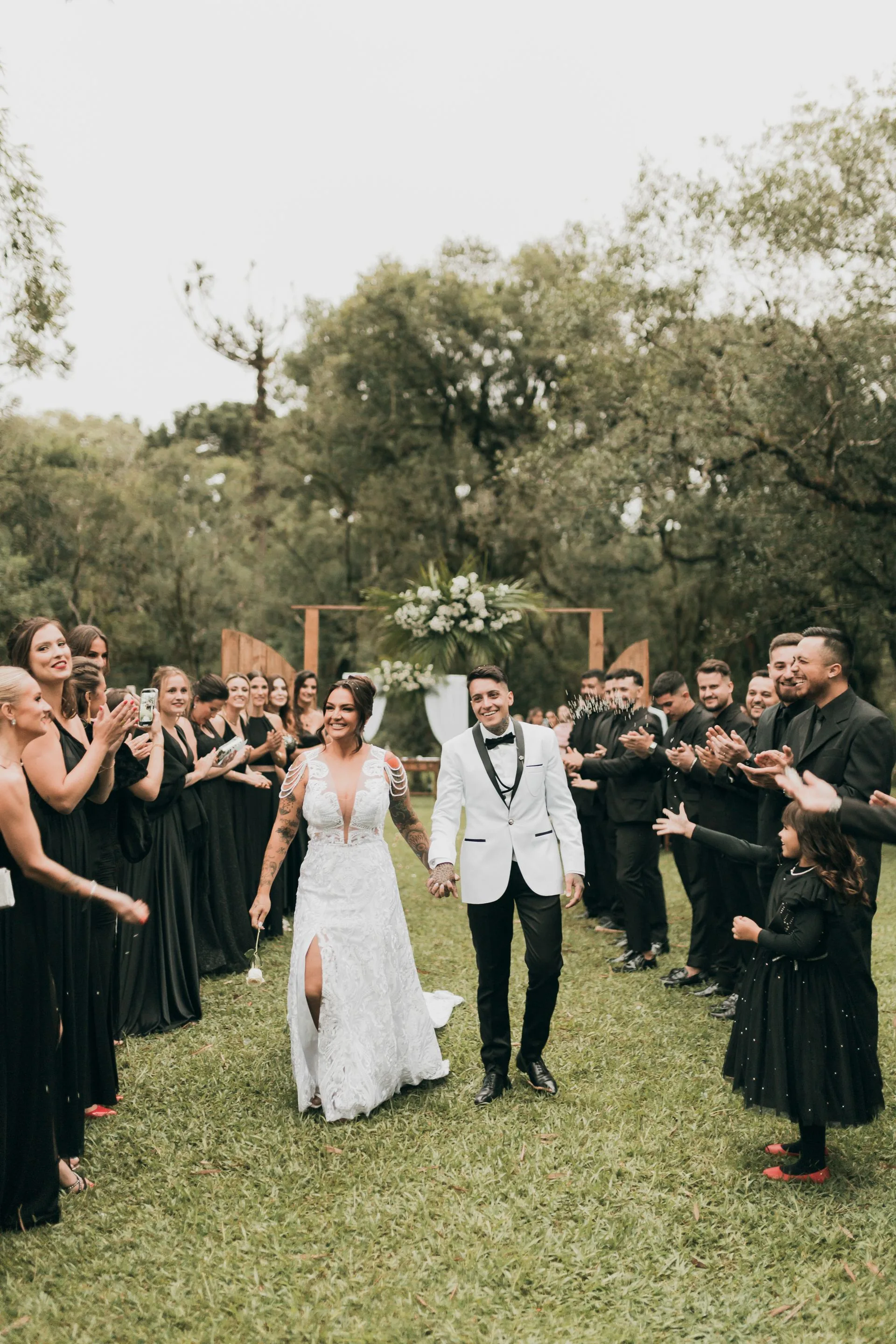 Newlywed couple walking down aisle